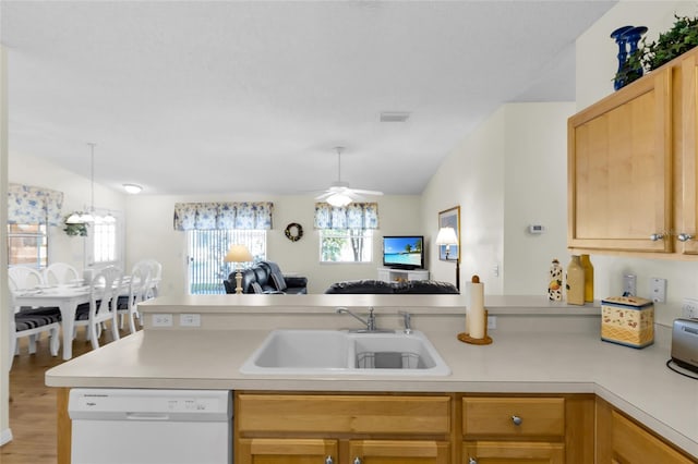 2111 Thornton Ter, The Villages, FL 32162 - kitchen featuring dishwasher, open floor plan, a sink, a peninsula, and light countertops
