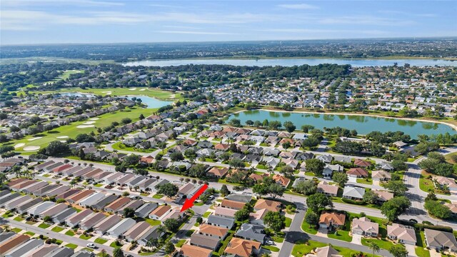 2111 Thornton Ter, The Villages, FL 32162 - aerial view of property's location featuring nearby suburban area, a local golf course, and a nearby body of water