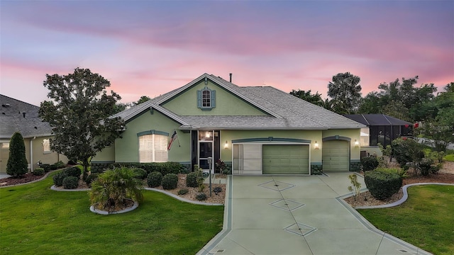 946 Isle Of Palms Path, The Villages, FL 32162 - ranch-style home with stucco siding, a garage, concrete driveway, and a front lawn