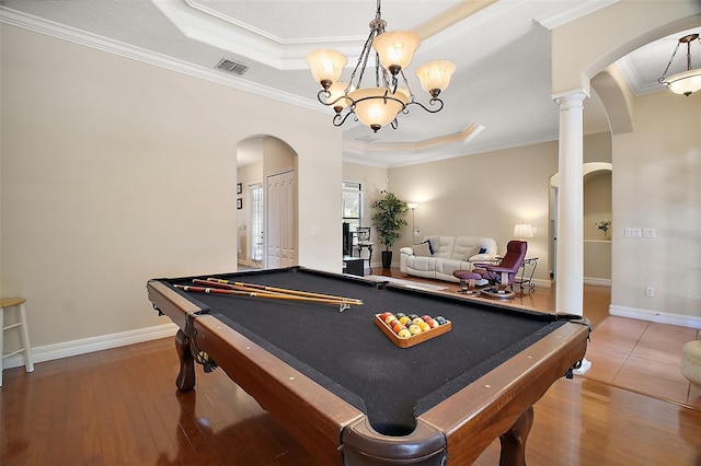 21206 Canoe Pass St, Clermont, FL 34715 - playroom featuring a raised ceiling, arched walkways, crown molding, wood finished floors, and billiards table