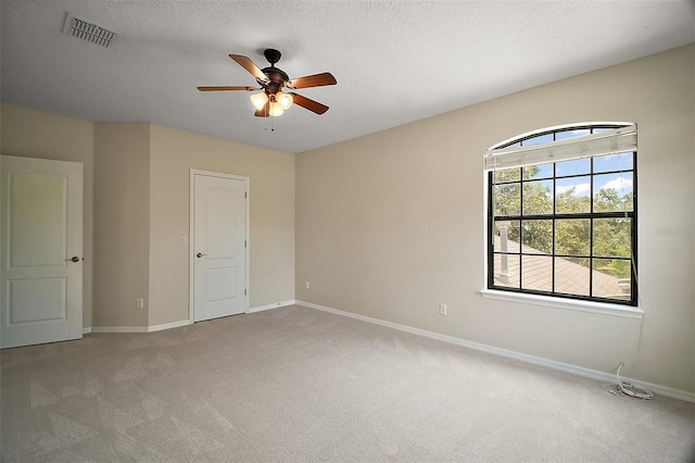 21206 Canoe Pass St, Clermont, FL 34715 - unfurnished bedroom featuring carpet, baseboards, ceiling fan, and a textured ceiling