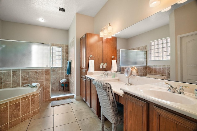 21206 Canoe Pass St, Clermont, FL 34715 - full bath with double vanity, a garden tub, a tile shower, and tile patterned flooring
