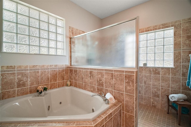 21206 Canoe Pass St, Clermont, FL 34715 - bathroom featuring a jetted tub and tiled shower
