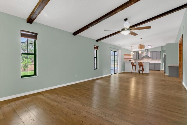 717 SE 46th Ct, Ocala, FL 34471 - unfurnished living room featuring a ceiling fan and wood finished floors