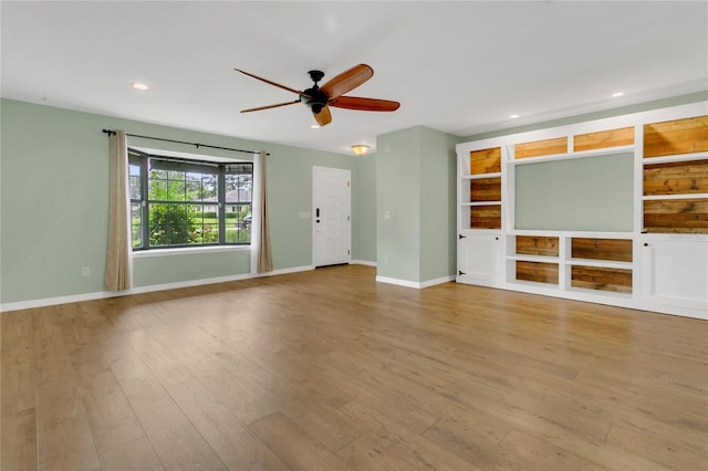 717 SE 46th Ct, Ocala, FL 34471 - unfurnished living room with a ceiling fan, wood finished floors, and recessed lighting