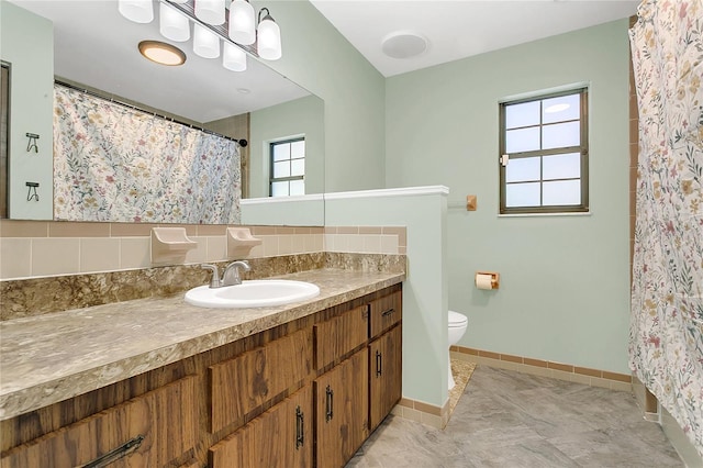 717 SE 46th Ct, Ocala, FL 34471 - bathroom featuring vanity, decorative backsplash, and a shower with curtain
