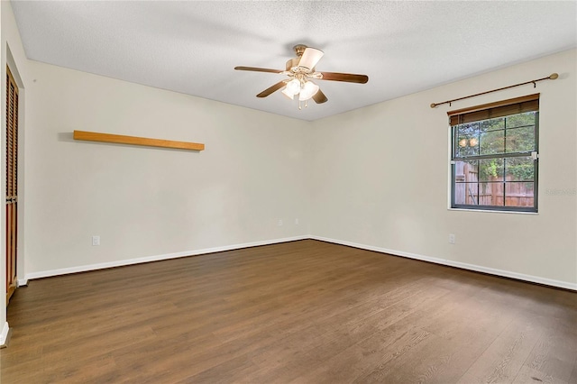 717 SE 46th Ct, Ocala, FL 34471 - empty room with wood finished floors, a ceiling fan, and a textured ceiling