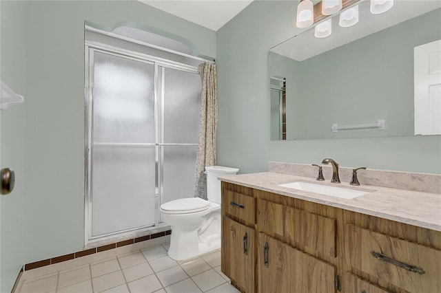 717 SE 46th Ct, Ocala, FL 34471 - bathroom featuring a shower with shower curtain, vanity, and tile patterned floors
