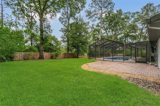 717 SE 46th Ct, Ocala, FL 34471 - fenced backyard featuring a patio and a lanai