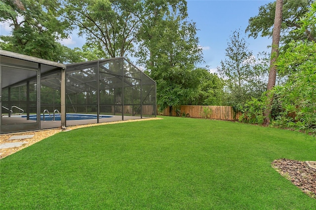717 SE 46th Ct, Ocala, FL 34471 - fenced backyard with a lanai