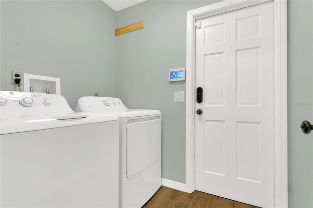 717 SE 46th Ct, Ocala, FL 34471 - laundry room with independent washer and dryer and wood finished floors
