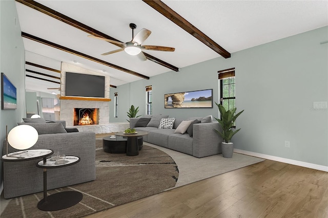 717 SE 46th Ct, Ocala, FL 34471 - living area featuring wood finished floors, a stone fireplace, and a ceiling fan
