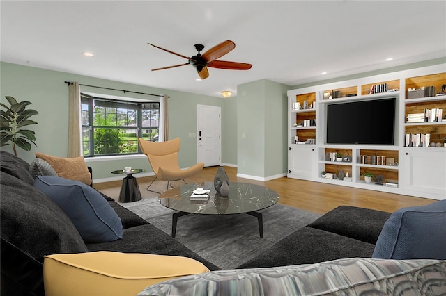 717 SE 46th Ct, Ocala, FL 34471 - living room with a ceiling fan, wood finished floors, and recessed lighting
