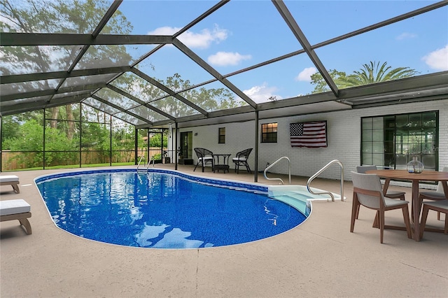 717 SE 46th Ct, Ocala, FL 34471 - outdoor pool with a patio area, outdoor dining space, and glass enclosure