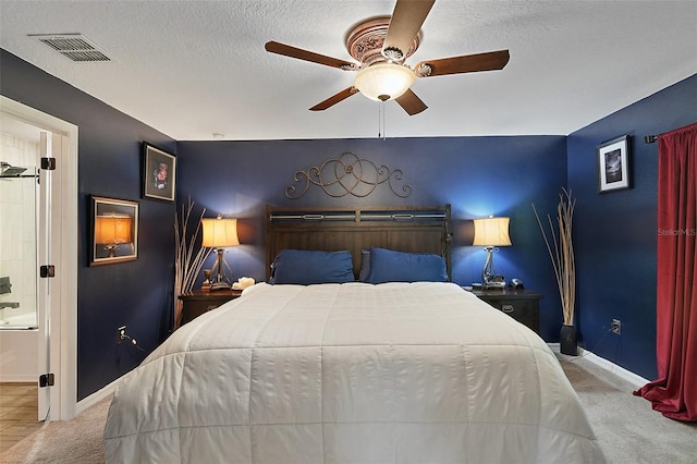 12952 Del Lago Dr, Astatula, FL 34705 - carpeted bedroom featuring baseboards, a textured ceiling, and ceiling fan