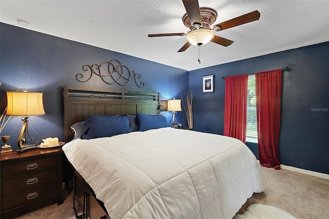 12952 Del Lago Dr, Astatula, FL 34705 - bedroom with carpet floors, a ceiling fan, baseboards, and a textured ceiling