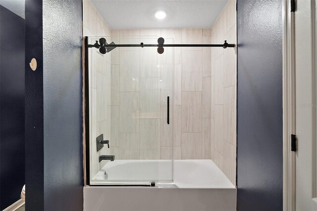 12952 Del Lago Dr, Astatula, FL 34705 - bathroom with a textured wall and enclosed tub / shower combo