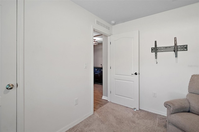 12952 Del Lago Dr, Astatula, FL 34705 - living area featuring carpet flooring and baseboards