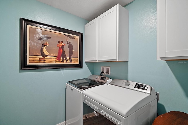 12952 Del Lago Dr, Astatula, FL 34705 - laundry room featuring cabinet space, washing machine and clothes dryer, and wood finished floors