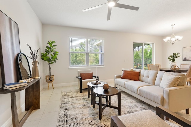 17112 Goldcrest Loop, Clermont, FL 34714 - living room featuring a chandelier, ceiling fan, and light tile patterned flooring
