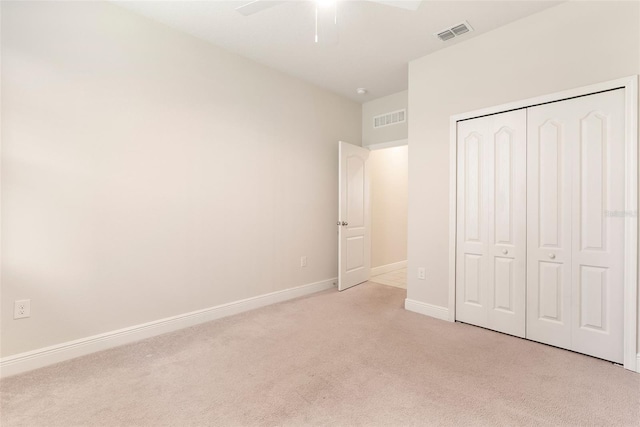 17112 Goldcrest Loop, Clermont, FL 34714 - unfurnished bedroom featuring light colored carpet, a closet, and a ceiling fan