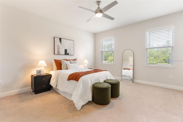 17112 Goldcrest Loop, Clermont, FL 34714 - bedroom with light colored carpet and ceiling fan