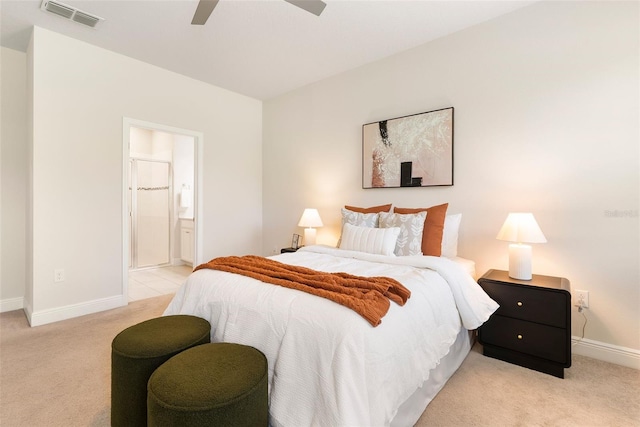 17112 Goldcrest Loop, Clermont, FL 34714 - bedroom with light colored carpet, connected bathroom, and a ceiling fan