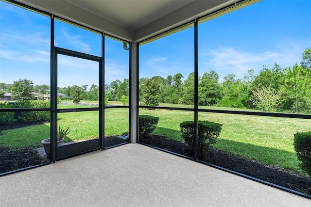17112 Goldcrest Loop, Clermont, FL 34714 - unfurnished sunroom featuring view of scattered trees