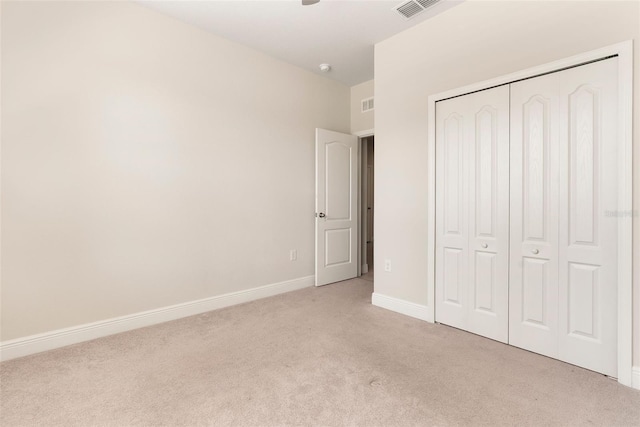 17112 Goldcrest Loop, Clermont, FL 34714 - unfurnished bedroom with light colored carpet and a closet