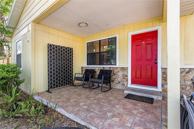 43 Almond Pass Dr, Ocala, FL 34472 - doorway to property featuring a porch and stone siding