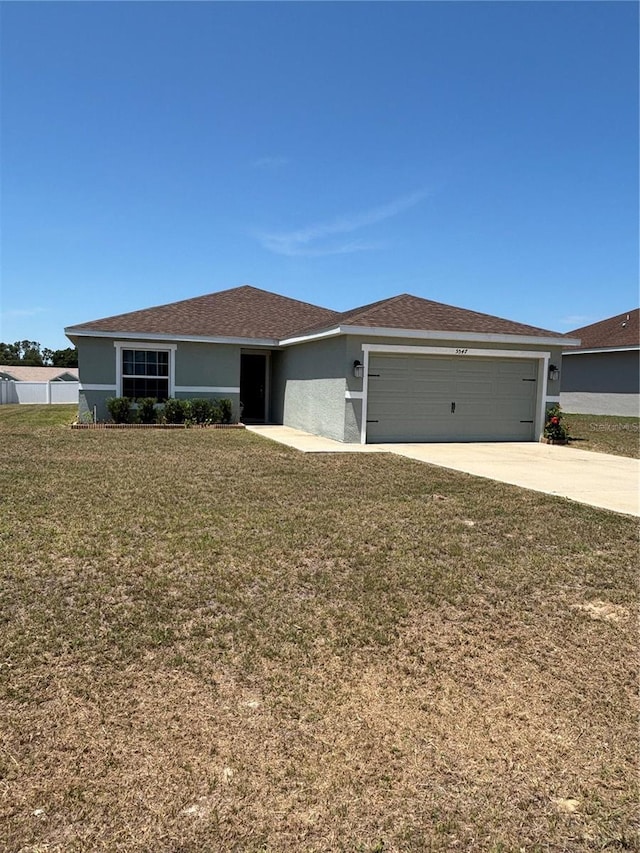 5547 SE 91st Pl, Ocala, FL 34480 - ranch-style home with a garage, a front lawn, driveway, and stucco siding