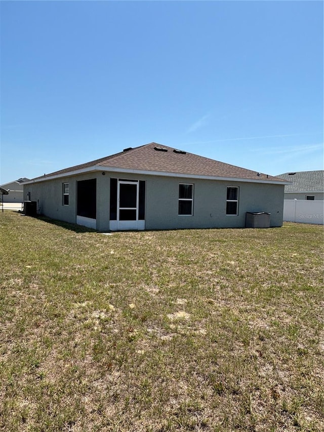 5547 SE 91st Pl, Ocala, FL 34480 - rear view of house with stucco siding and cooling unit