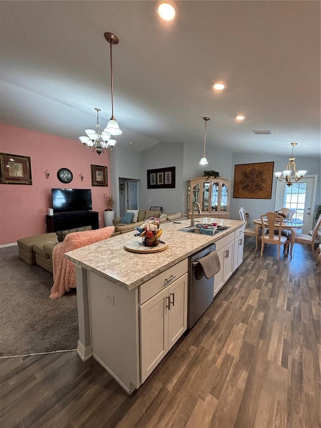 5547 SE 91st Pl, Ocala, FL 34480 - kitchen with a chandelier, a sink, stainless steel dishwasher, white cabinetry, and vaulted ceiling