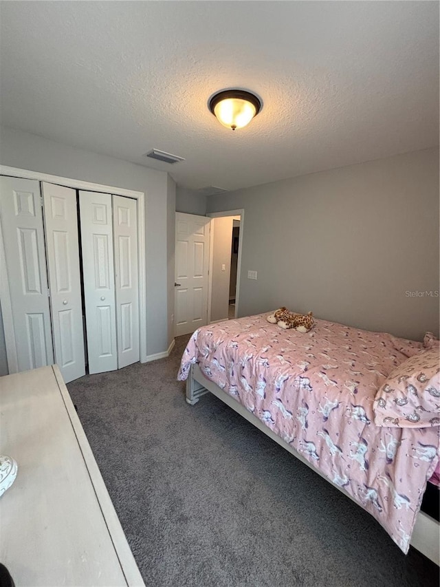 5547 SE 91st Pl, Ocala, FL 34480 - bedroom with carpet floors, a closet, and a textured ceiling