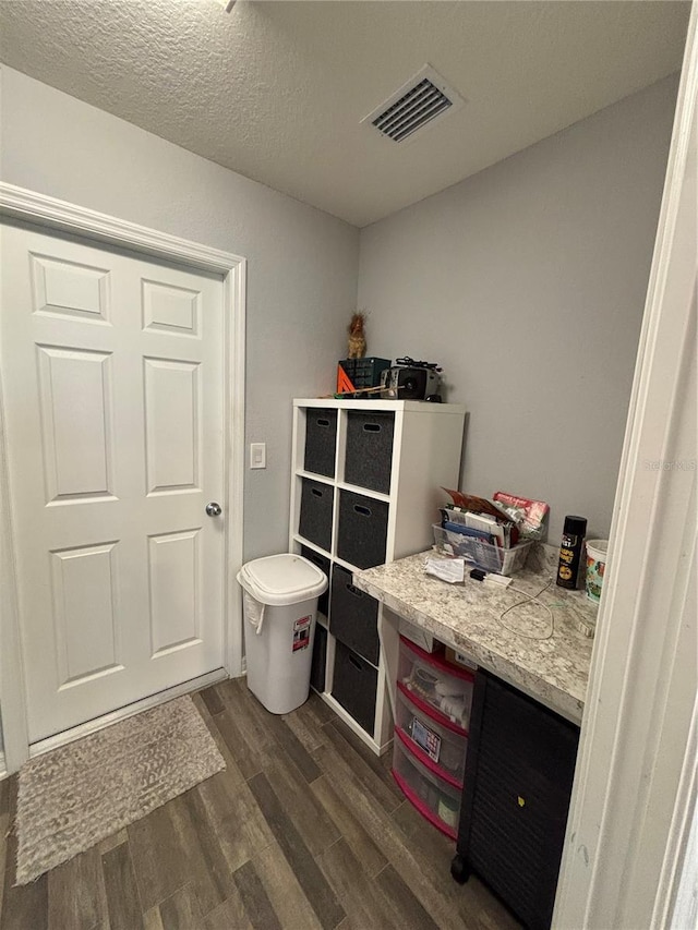 5547 SE 91st Pl, Ocala, FL 34480 - interior space featuring dark wood-style floors and a textured ceiling