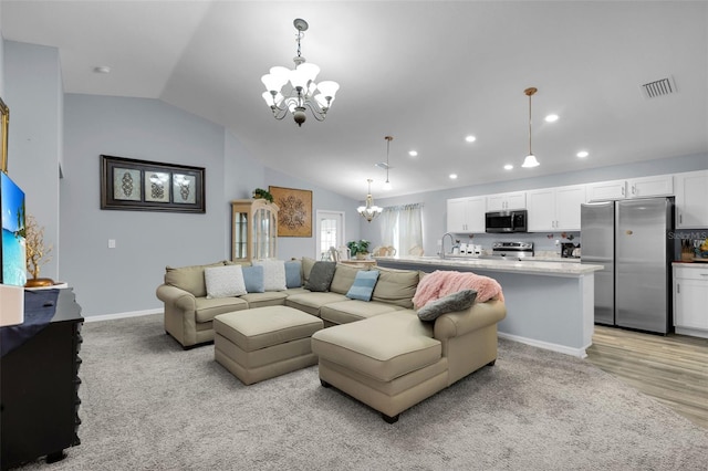 5547 SE 91st Pl, Ocala, FL 34480 - living room with a chandelier, vaulted ceiling, and recessed lighting