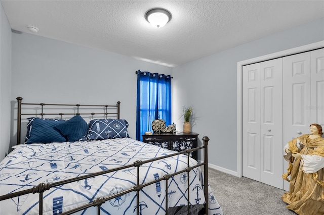 5547 SE 91st Pl, Ocala, FL 34480 - carpeted bedroom featuring a closet and a textured ceiling