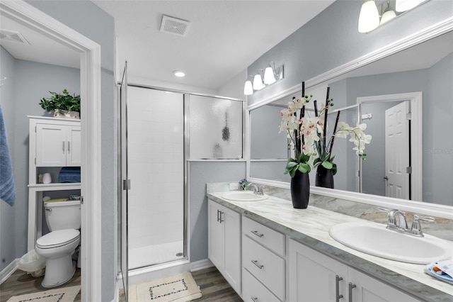 5547 SE 91st Pl, Ocala, FL 34480 - full bath with double vanity, a stall shower, and wood finished floors