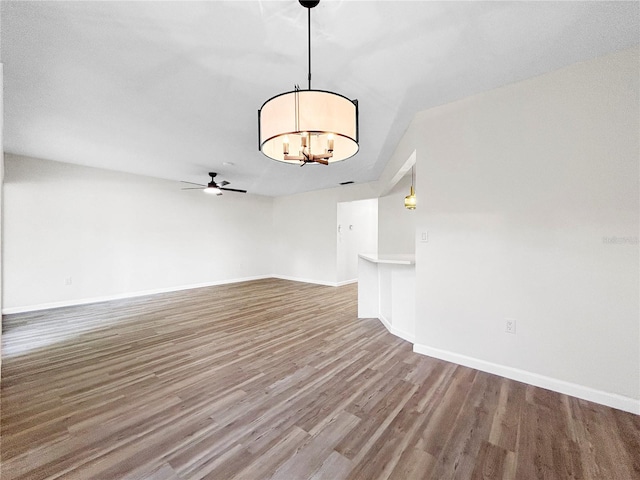 5136 Cedar Hammock Dr, Sarasota, FL 34232 - unfurnished room featuring wood finished floors, ceiling fan, baseboards, and a chandelier
