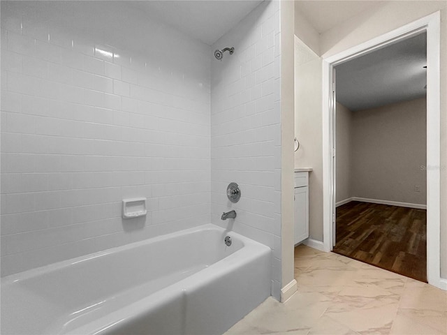 5136 Cedar Hammock Dr, Sarasota, FL 34232 - bathroom with marble finish floors, shower / washtub combination, and baseboards