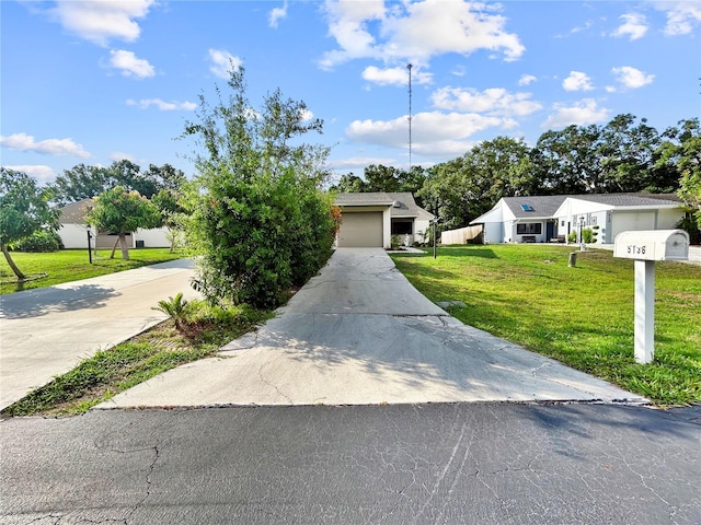 5136 Cedar Hammock Dr, Sarasota, FL 34232 - view of front of house featuring concrete driveway and a front lawn