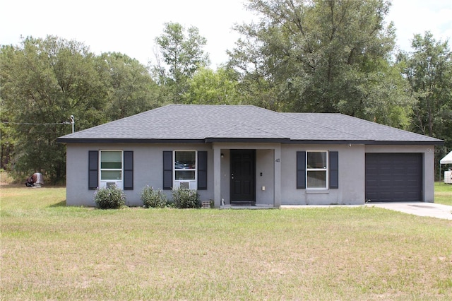 41 Dogwood Loop, Ocala, FL 34472 - ranch-style house featuring a shingled roof, stucco siding, a garage, a front lawn, and concrete driveway