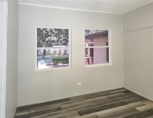 365 Fletcher Ave, Daytona Beach, FL 32114 - spare room featuring ornamental molding, dark wood-type flooring, and a textured wall