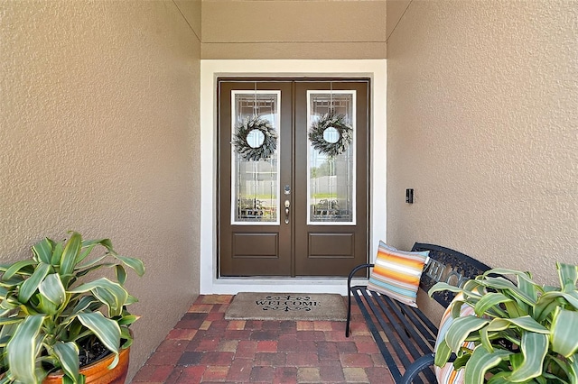440 Bellissimo Pl, Howey In The Hills, FL 34737 - doorway to property featuring french doors and stucco siding