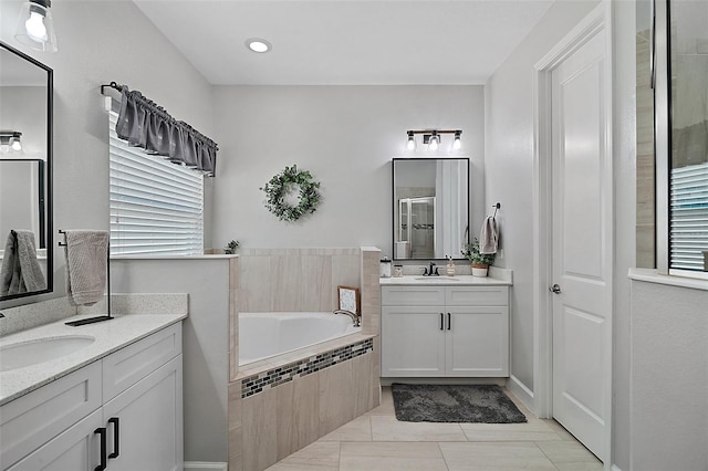 440 Bellissimo Pl, Howey In The Hills, FL 34737 - bathroom featuring a shower stall, a bath, two vanities, radiator, and tile patterned floors