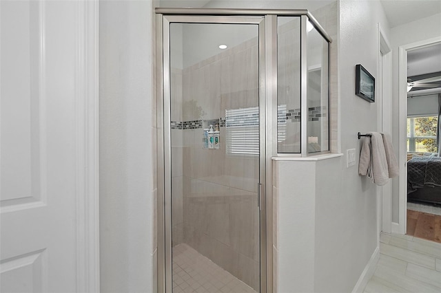 440 Bellissimo Pl, Howey In The Hills, FL 34737 - bathroom featuring connected bathroom, a stall shower, and baseboards