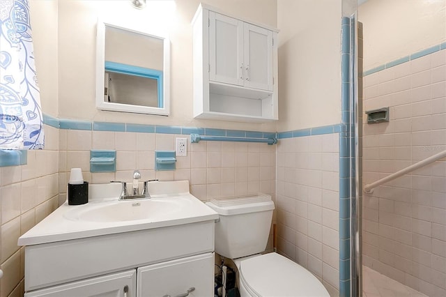 2007 Mosher Dr, Orlando, FL 32810 - full bathroom featuring vanity, toilet, wainscoting, tile walls, and a shower stall