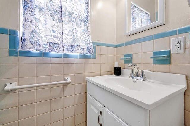 2007 Mosher Dr, Orlando, FL 32810 - bathroom featuring vanity and tile walls