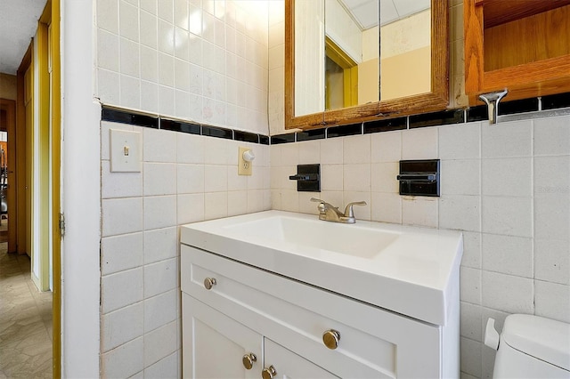 2007 Mosher Dr, Orlando, FL 32810 - half bathroom with vanity, toilet, and tile walls