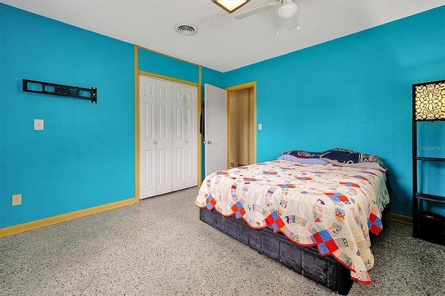 2007 Mosher Dr, Orlando, FL 32810 - bedroom with speckle patterned floor, a closet, baseboards, and a ceiling fan